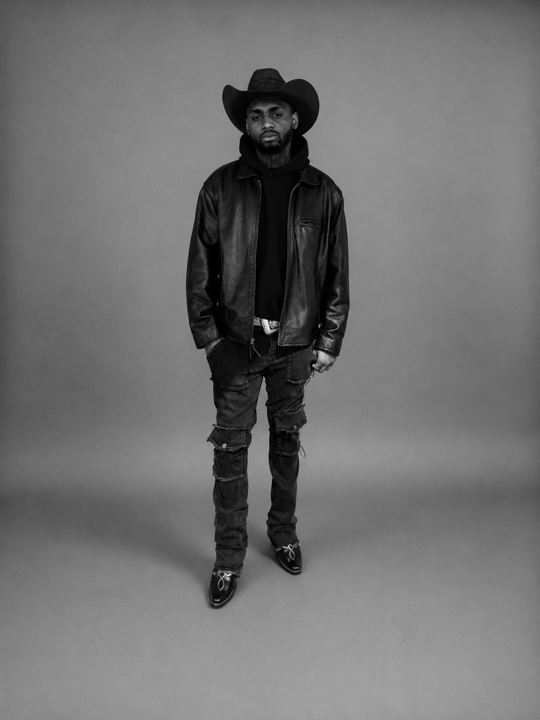 A Broken Hart Kid wearing a cowboy hat and leather jacket